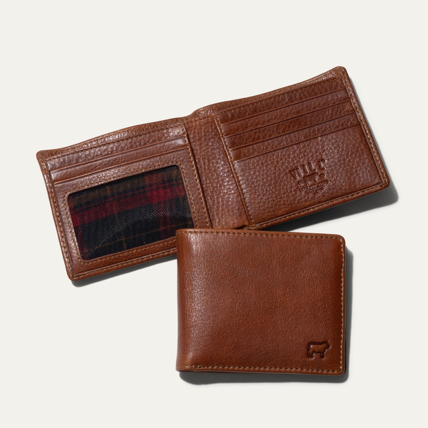 Brown leather bifold wallet showing interior card slots and exterior design