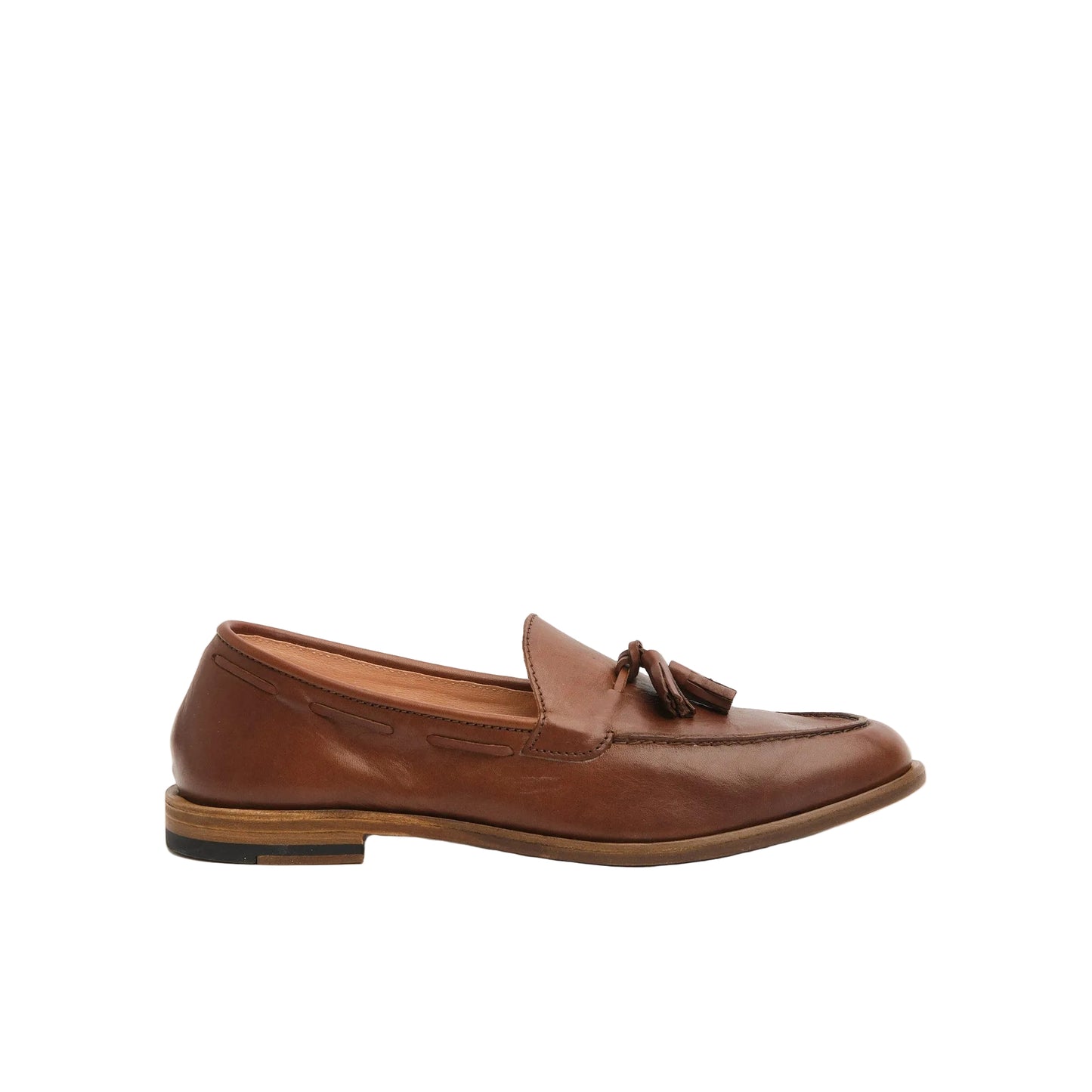 Brown leather tassel loafers with wooden sole on neutral background