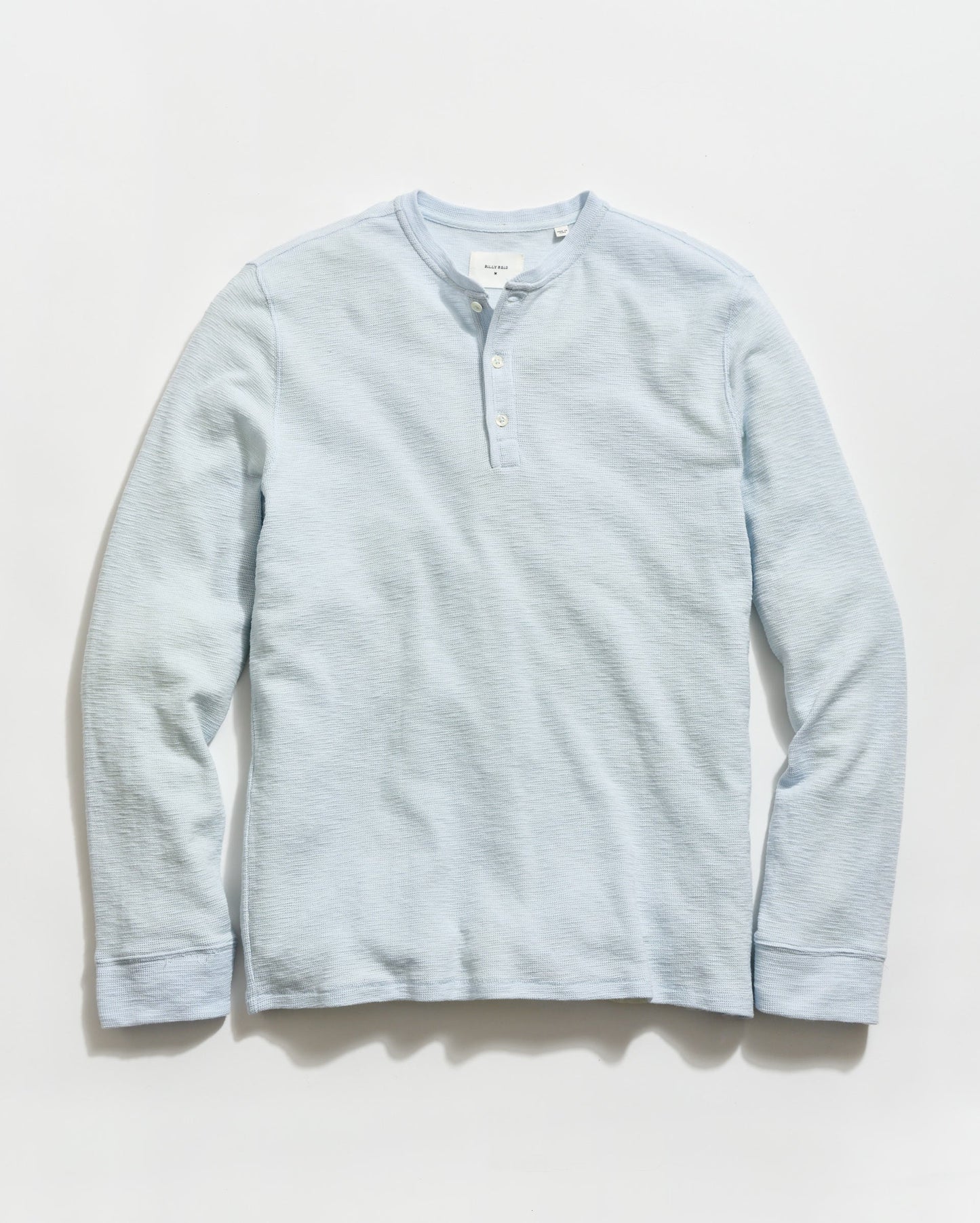 Light blue heathered long sleeve henley shirt with button placket